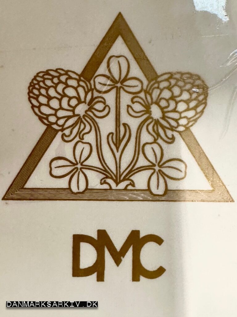 Logo fra Det Danske Mælkecompagni DMC